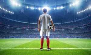 Football,Player,With,Ball,In,The,Stadium,,3d,Rendering