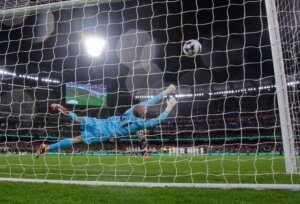 Goalkeeper,,Alfie,Whiteman,Of,Tottenham,Dives,To,Block,The,Ball